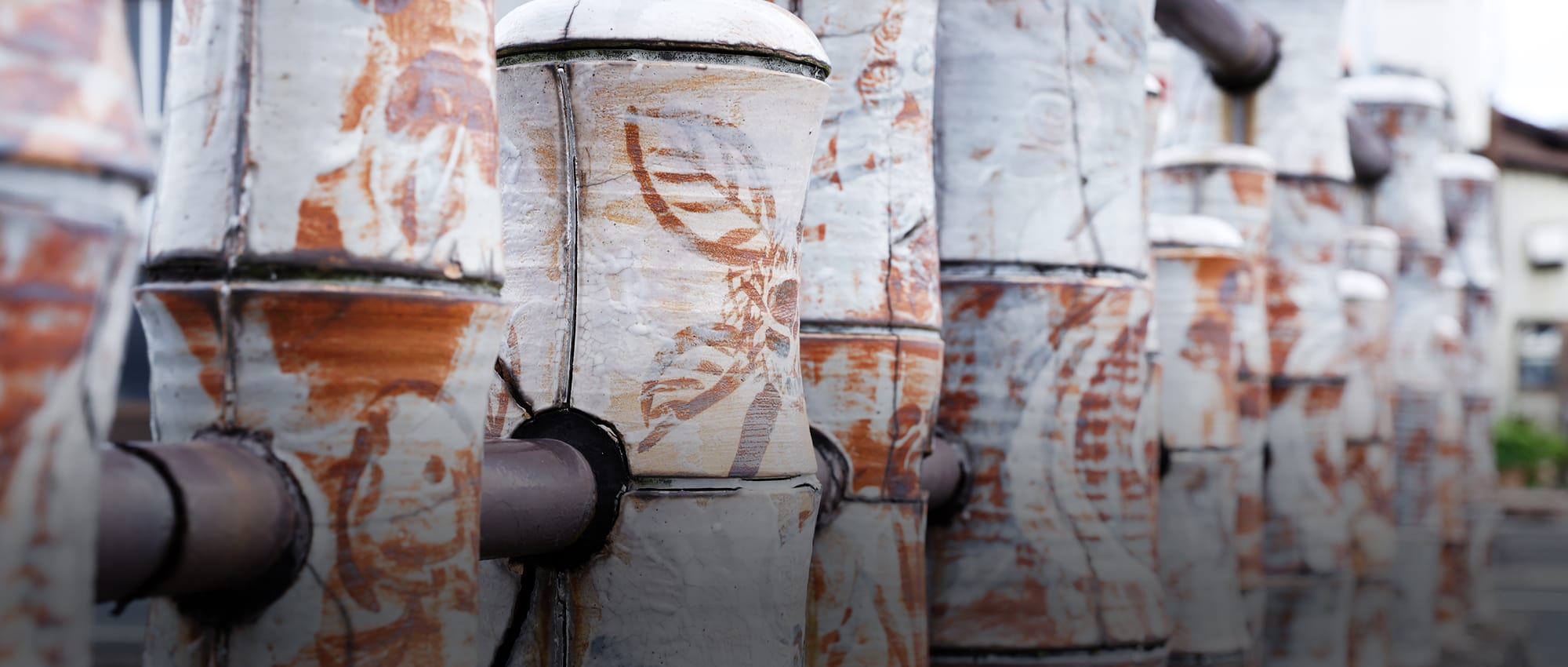 The Seto River, which runs through the city, is crossed by numerous bridges decorated with ceramics. Azuma Bridge, shown in the photograph, is just one of them. 